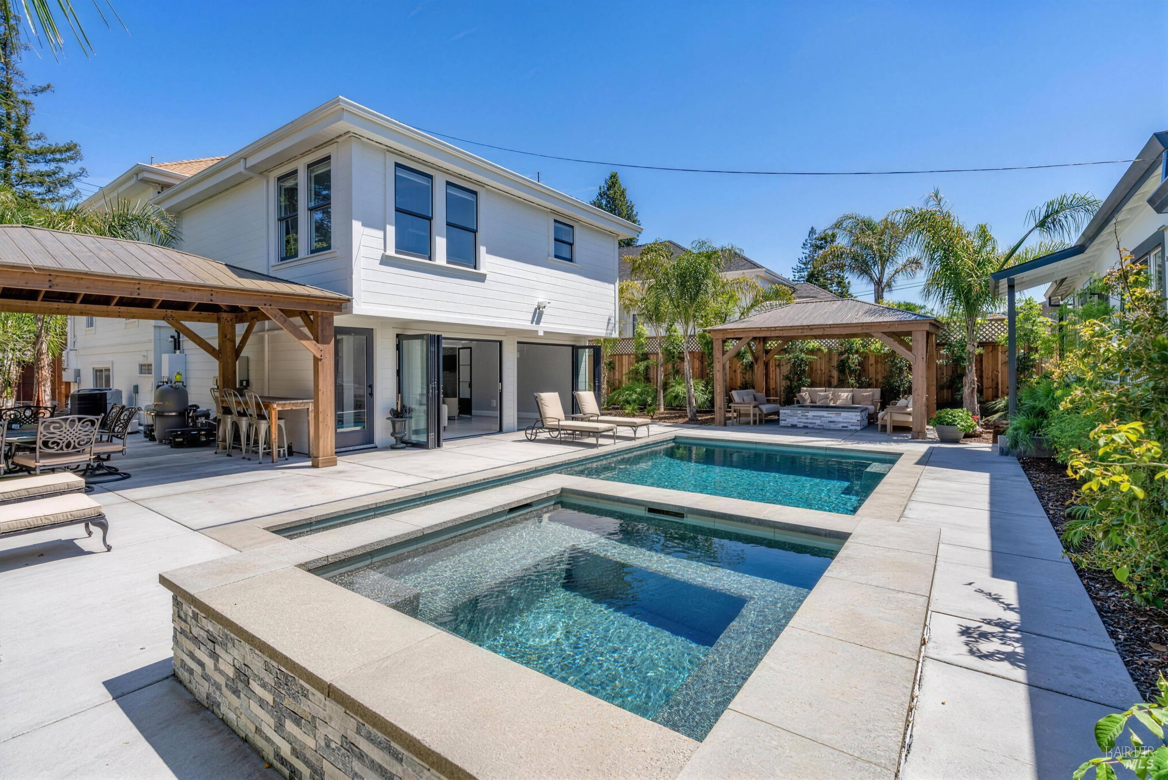 A heated pool and spa beside a restored Victorian in downtown Napa